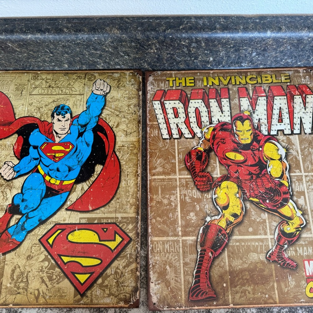 Superman and Iron man tin signs.